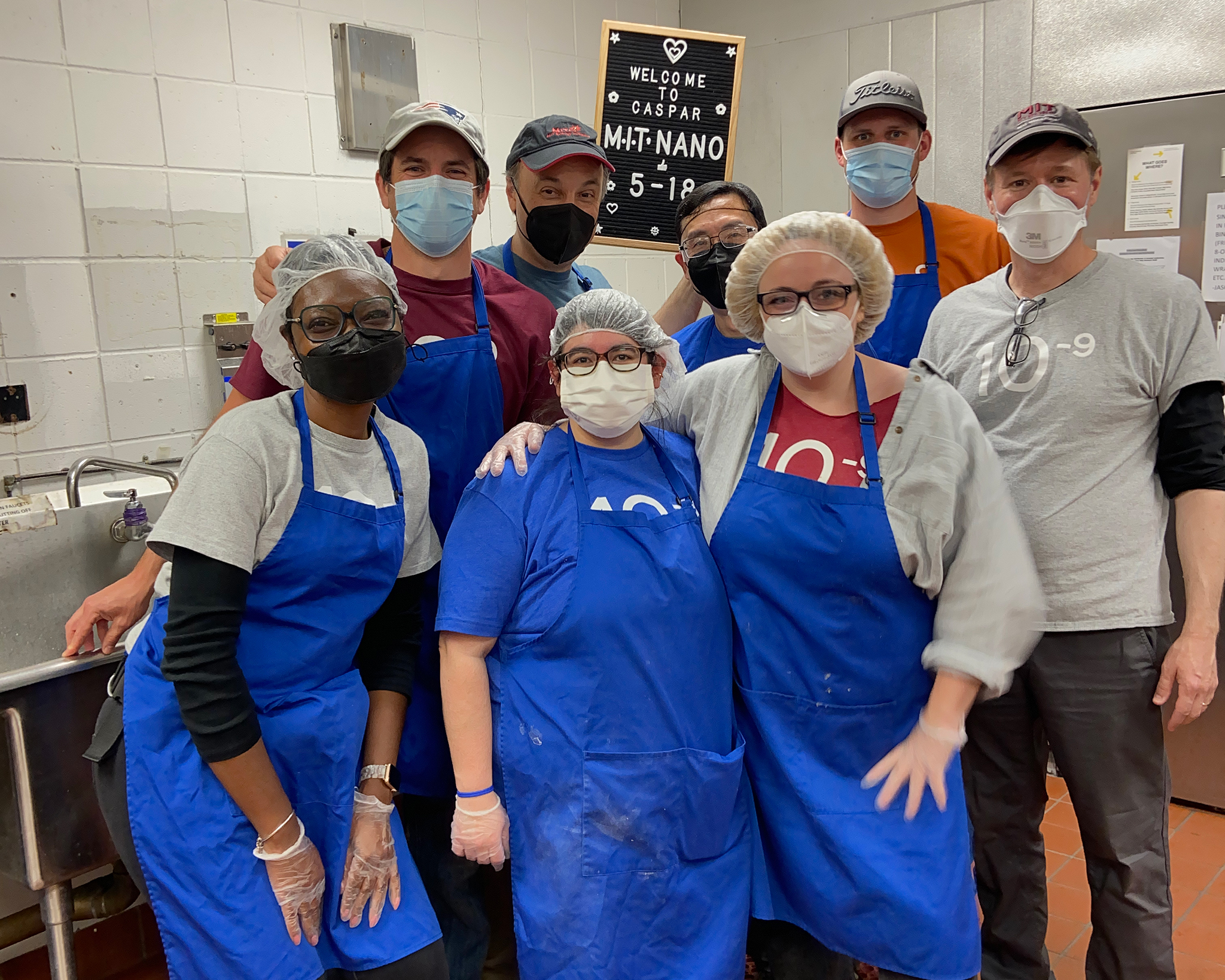 The volunteer crew from MIT.nano poses in the CASPAR Kitchen.