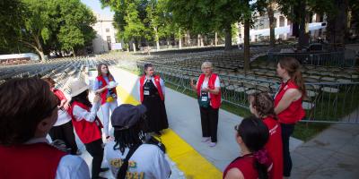 Volunteers gather for a briefing in Killian Court